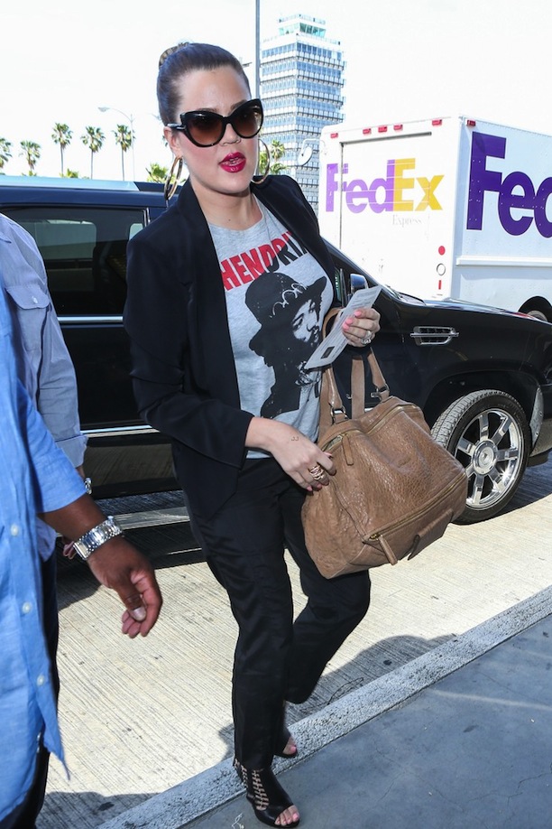Khloe Kardashian at LAX Airport in a Forever 21 Jimi Hendrix Tee and Kardashian Kollection Drawstring Pants www.jinnaloves.com